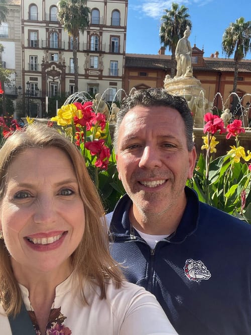 Heather King and Michael beside a fountain in Seville